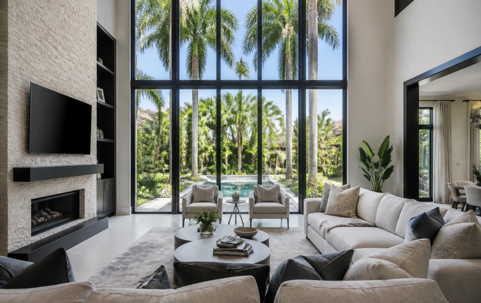 The same living room with residential window film: balanced light, reduced glare and a clear view outside